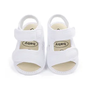 Front view of breathable white baby mesh sandals with velcro straps for infants