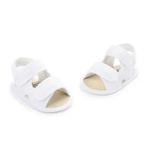 Detailed overhead view of breathable white mesh baby sandals for summer walking steps