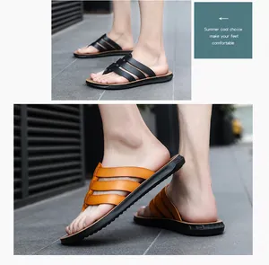 Detailed view of men's summer leather flip flops in black and tan with comfortable straps.