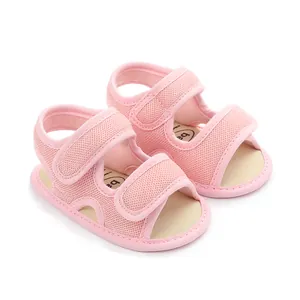 Detailed view of pink breathable mesh baby sandals with secure Velcro straps for toddlers