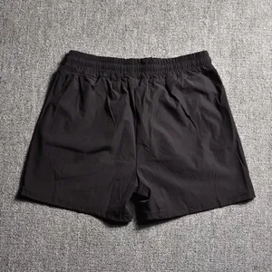 Back view of black men's athletic shorts with elastic waistband for fitness and running