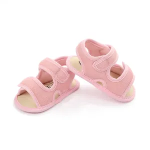 Pair of pink mesh breathable baby summer sandals with velcro straps