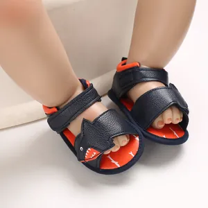 Detailed view of cute cartoon shark baby sandals with navy blue soft sole for toddlers