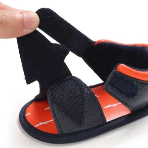 Detailed view of breathable baby walker sandals featuring adjustable hook and loop straps.