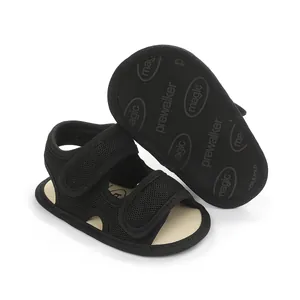 Detail view of black baby pre-walker sandals with anti-slip patterned sole
