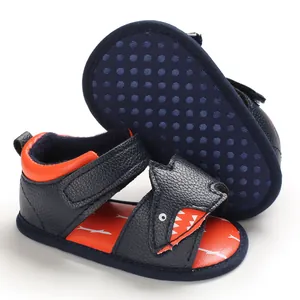 Detail view of navy blue cartoon shark baby walking sandals with non-slip soft sole