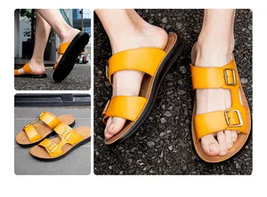 Detailansicht der gelben Leder-Herrensandalen mit schicken doppelten Metallschnallen.