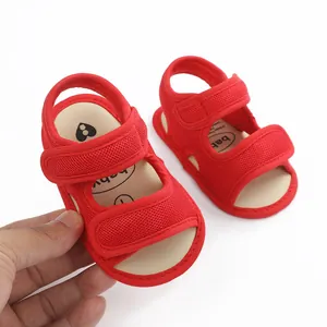 Macro view of red mesh baby sandals showing the soft texture and velcro straps.