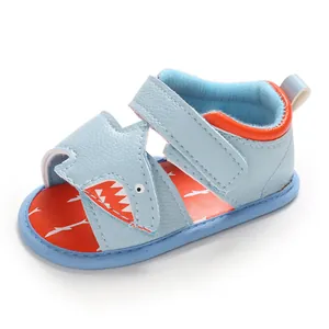 Detailed view of cute blue cartoon shark baby sandals with soft breathable soles