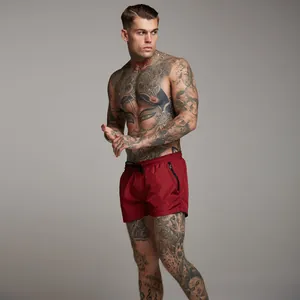 Professional men's athletic red fitness shorts featuring a zipper pocket and drawstring waist