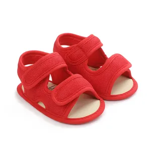 Detailed view of breathable red mesh infant sandals featuring dual Velcro straps