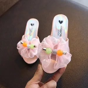 Pink girl's princess slippers with mesh bow and crystal heart design for summer.