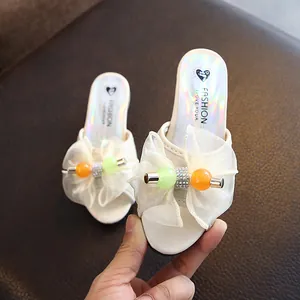 Elegant white girl's high heel princess slippers featuring mesh bow and colorful bead decor