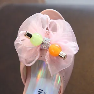 Pink girl's princess sandal with large organza bow and colorful decorative beads