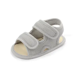 Detail view of breathable gray mesh baby sandals with secure double velcro straps
