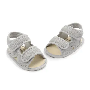 Detail shot of breathable grey mesh baby sandals featuring secure double velcro straps