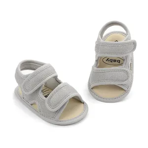 Detailed view of grey breathable mesh baby sandals with dual velcro straps