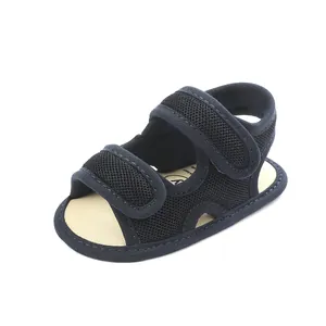 Detail view of navy blue mesh baby sandals for summer with adjustable velcro straps