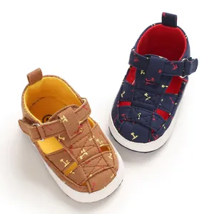 Pair of soft baby cotton sandals in brown and navy blue with anti-slip walking soles.