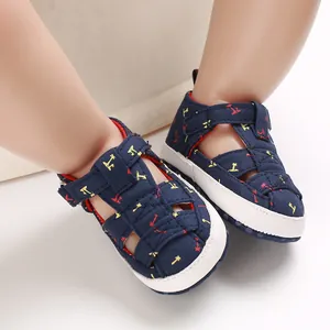 Close-up of navy blue baby cotton sandals with soft non-slip soles on feet