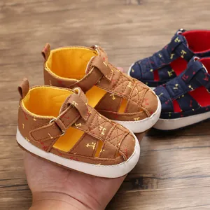 Close-up showing the soft cotton material and non-slip sole of the infant walking sandals