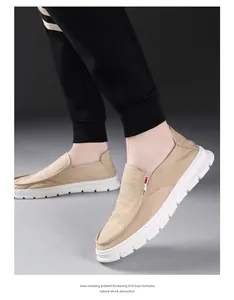 Close-up of men's beige canvas loafers with thick white EVA foam shock-absorbing soles