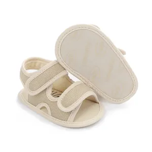 Detailed view of breathable beige infant sandals showing the anti-slip sole structure.