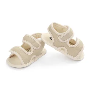 Breathable beige mesh baby sandals with double velcro straps for summer walking shoes.