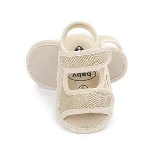 Detailed top view of beige infant mesh sandals with adjustable velcro straps
