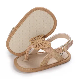 Detailed view of rose gold baby sandals with butterfly decor and anti-slip soft sole