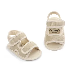 Detail view of breathable beige baby sandals with adjustable velcro straps for walking