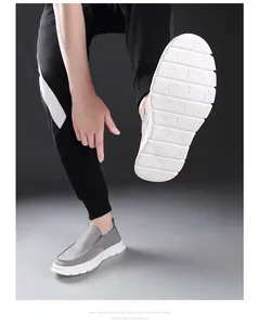 Detailed view of grey slip-on shoes with antiskid white EVA foam soles