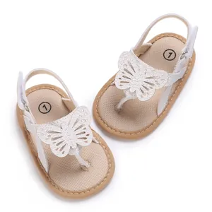 Detailed view of white baby butterfly sandals with soft breathable soles for infants