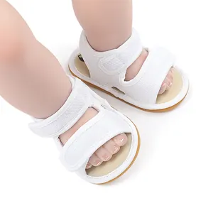 Close-up detail of white breathable mesh baby sandals with non-slip rubber sole