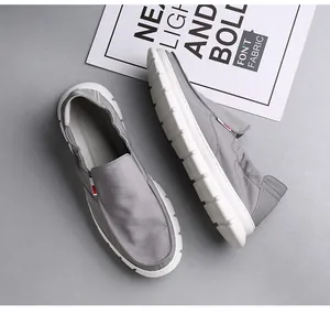 Lightweight men's casual grey canvas slip-on loafers with a flexible soft white sole