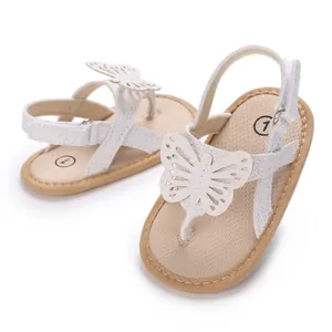 Detailed view of white baby walking sandals with butterfly applique and soft soles