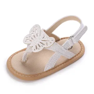Close-up of white baby summer sandal featuring a sparkly butterfly and breathable soft sole