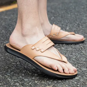 Classic tan leather thong sandals with rivets for beach and casual outdoor summer wear