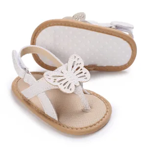 Close-up of white baby walker sandals with hollow butterfly decoration and soft sole