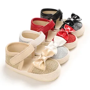 Detailed view of baby princess shoes in gold, silver, red, and black with glitter bows