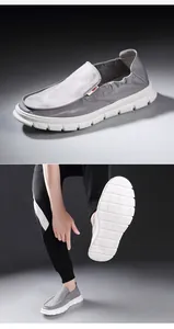 Men's casual grey slip-on loafers with flexible white anti-slip sole detail.