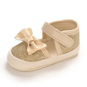 Detailed view of beige baby princess walking shoes with gold glitter and soft sole