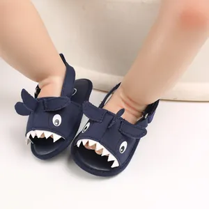 Detail view of navy blue shark cartoon baby sandals with soft soles for summer