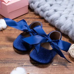 Elegant navy blue velvet baby shoes with a large decorative ribbon bow for toddlers
