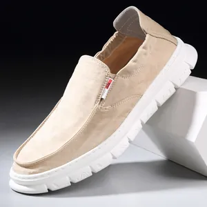 Classic beige men's slip-on canvas loafers featuring a comfortable thick soft white sole