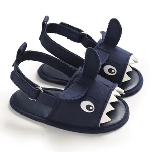 Detailed close-up view of navy blue baby shark sandals featuring soft soles and canvas material