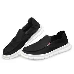 Breathable men's black casual canvas slip-on shoes with lightweight soft white sole