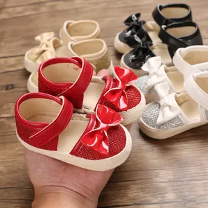 Adorable soft sole baby princess walking shoes with glossy bow details in multiple colors