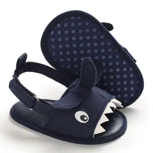 Close-up of navy blue baby shark sandals with soft anti-slip soles