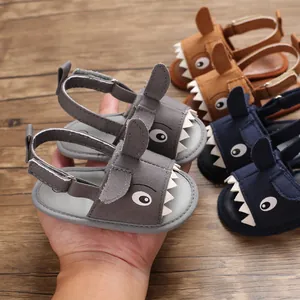 Cute shark cartoon baby sandals with soft soles available in gray, brown, and navy blue